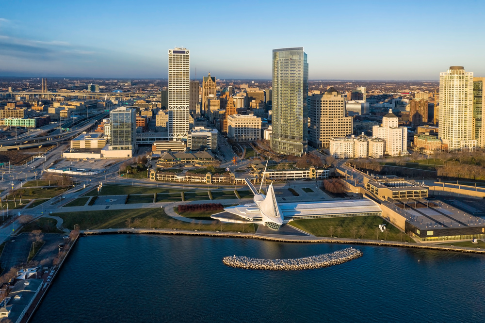 Aerial panorama view of Downtown Milwaukee at sunrise. Tall downtown buildings by the lake