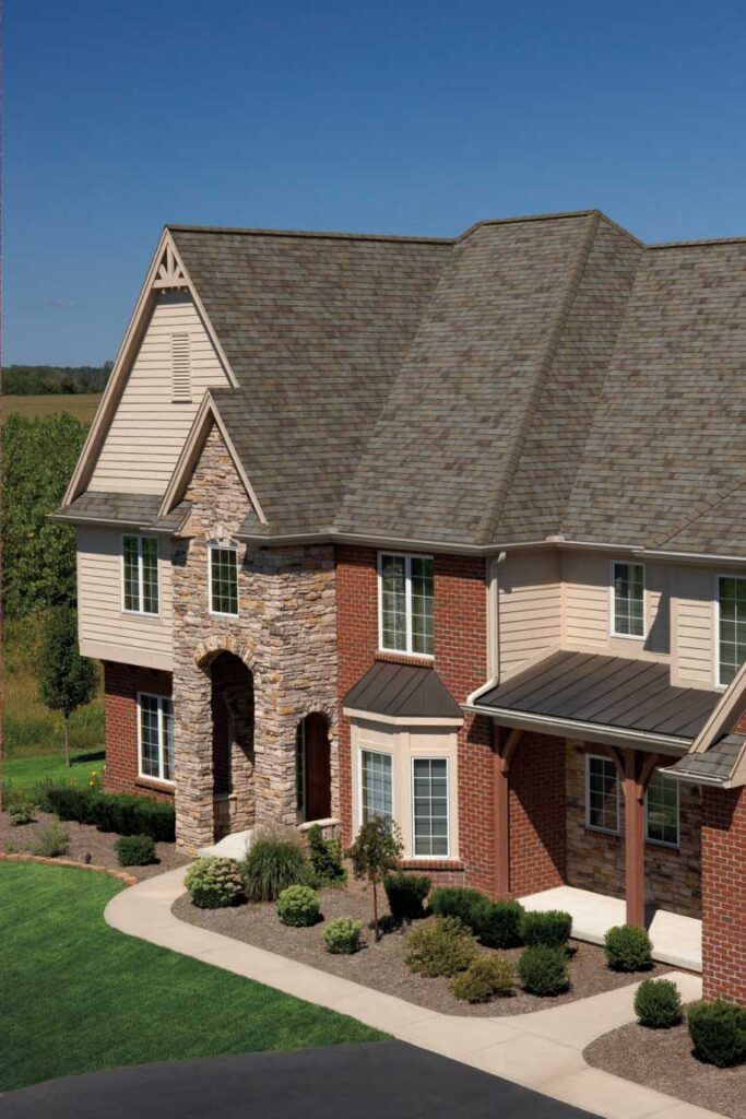 Owens Corning TruDefinition Duration architectural asphalt shingles in Driftwood color.