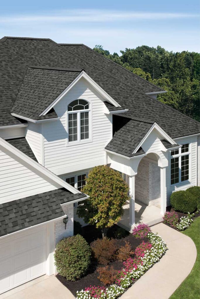 Owens Corning TruDefinition Duration asphalt shingles in Estate Gray color installed on residential roof.