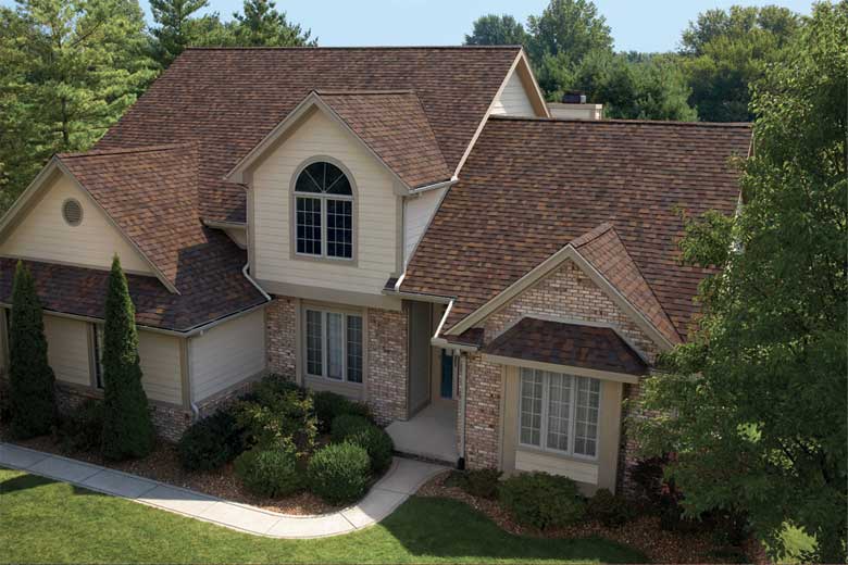 A brown roof featuring brown shingles and matching brown trim.